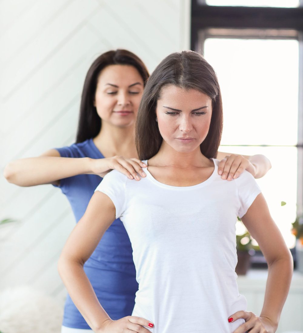 Woman is getting physical therapy from a professional doctor